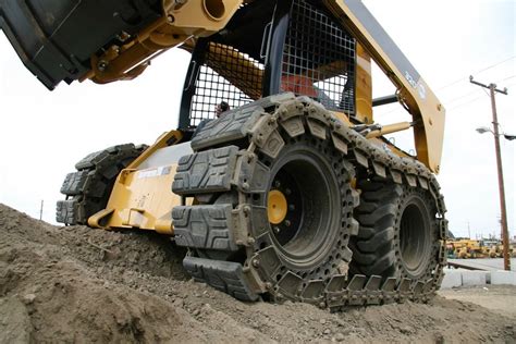 skid steer tracks vs wheels with tracks over|best tracked skid steer.